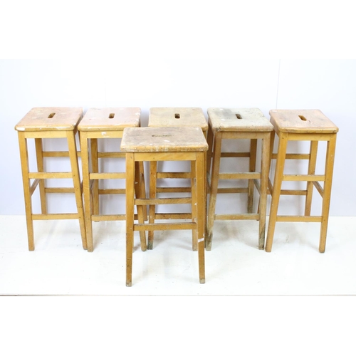665 - Set of six mid Century vintage wooden lab stools stamped Gomm Bros Ltd to underside of seats.