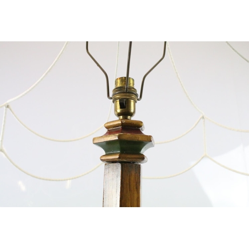 669A - 20th century substantial carved oak standard lamp, the four feet carved with flowers and leaves, the... 