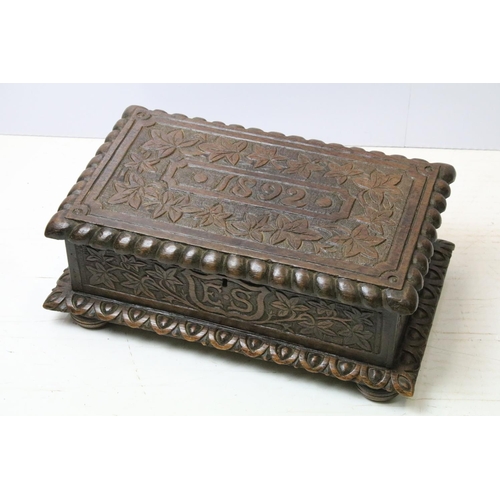 679 - Vintage carved oak bible box with the initials ES and dated 1892, 17cm high x 45cm x 27cm deep