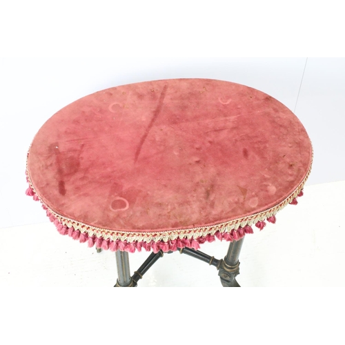 688 - Ebonized occasional table, of x-stretcher form, with fringed velvet covered oval top, on turned curv... 
