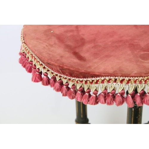 688 - Ebonized occasional table, of x-stretcher form, with fringed velvet covered oval top, on turned curv... 