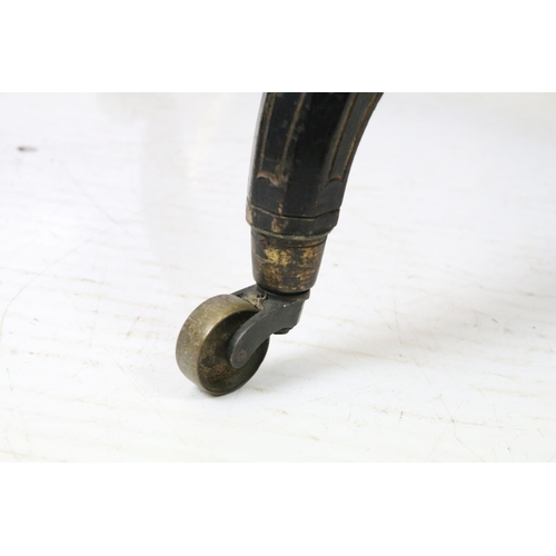 688 - Ebonized occasional table, of x-stretcher form, with fringed velvet covered oval top, on turned curv... 