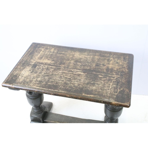 690 - Oak occasional table on substantial turned legs, 59cm high x 70cm wide x 46cm deep
