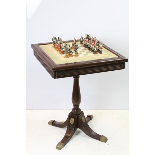 695 - Franklin Mint The Raj Chess Set with marble effect chess board within a mahogany frame raised on a b... 