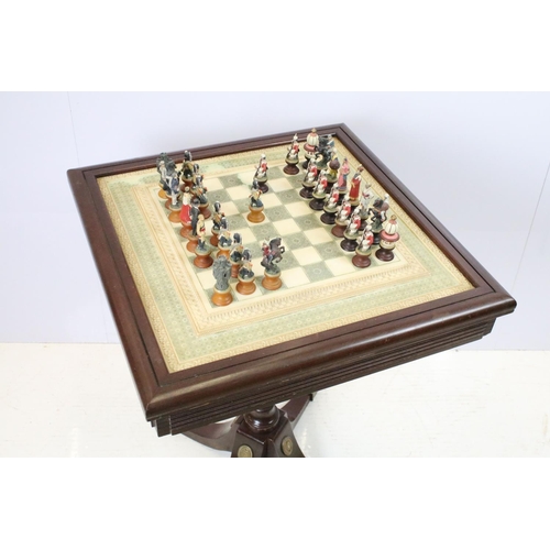 695 - Franklin Mint The Raj Chess Set with marble effect chess board within a mahogany frame raised on a b... 