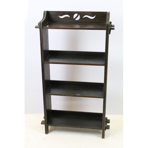 704 - Arts and Crafts oak open bookcase with four shelves, of pegged construction, with pierced decoration... 