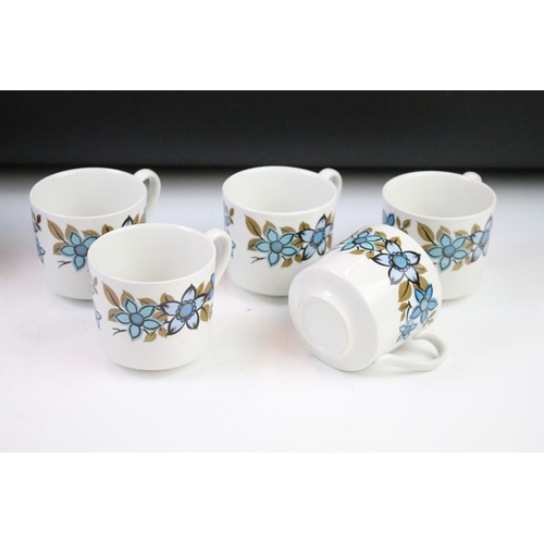 89 - Two 1970s coffee sets to include a Myott blue pattern set comprising coffee pot, five cups and sauce... 