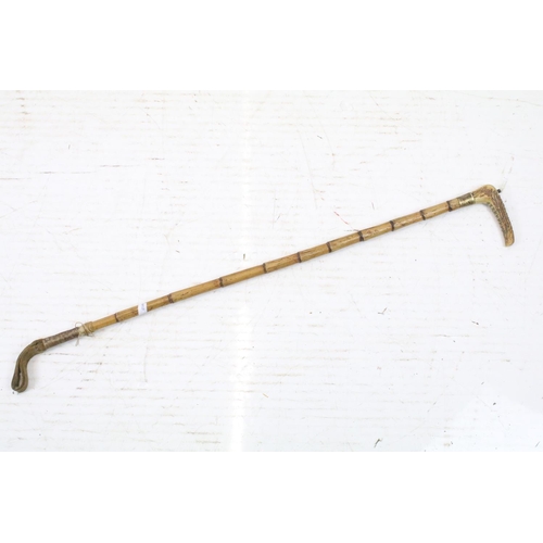 127 - Two vintage riding crops to include a bamboo example with gold plated collar, together with a late 1... 