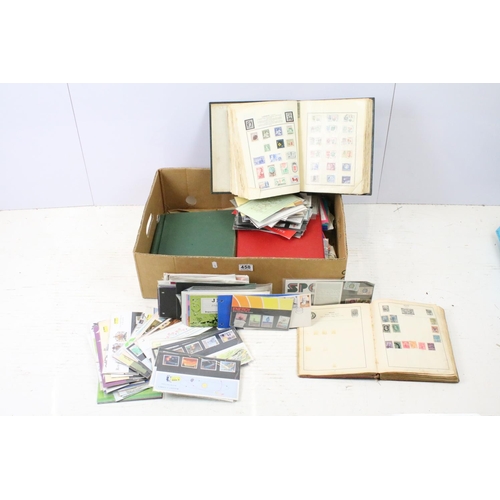 458 - Approximately 100 loose late 20th Century presentation pack stamps, together with an album of Guerns... 