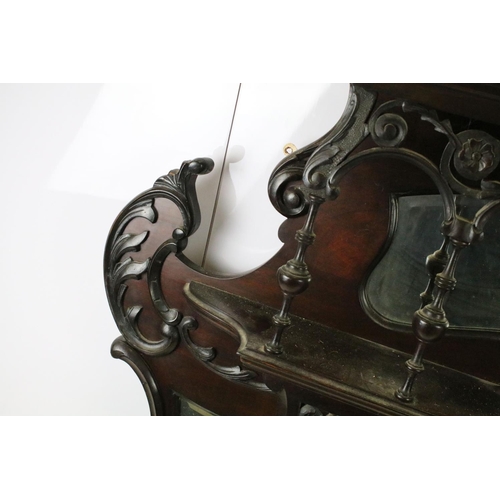 634 - Art Nouveau mahogany overmantel mirror, carved with scrolling flowers and foliage, with two candle s... 