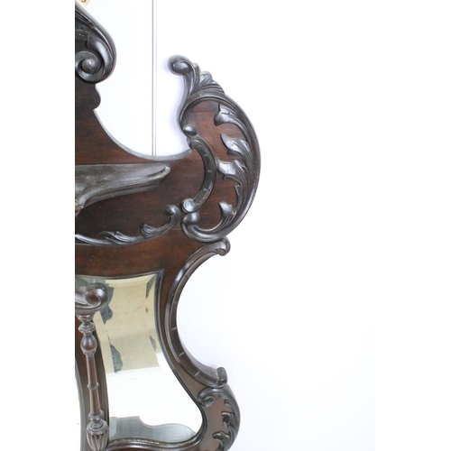 634 - Art Nouveau mahogany overmantel mirror, carved with scrolling flowers and foliage, with two candle s... 