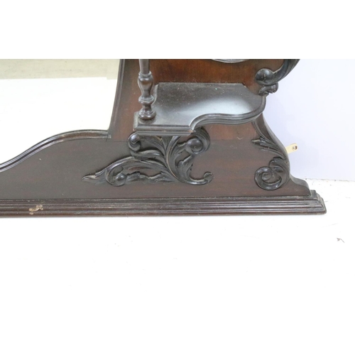 634 - Art Nouveau mahogany overmantel mirror, carved with scrolling flowers and foliage, with two candle s... 