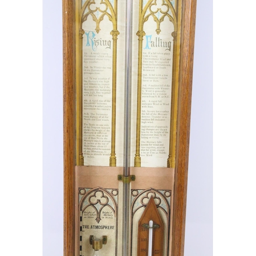 639 - Early 20th century oak cross framed Admiral Fitzroys barometer, with paper dial, the sides with twin... 
