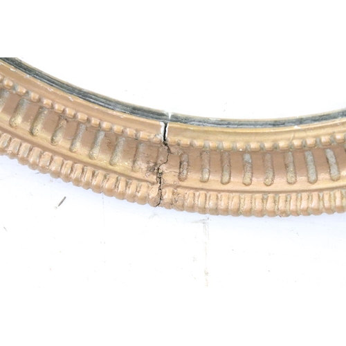 640 - Bevelled glass mirror of oval form with oval painted plaster frame