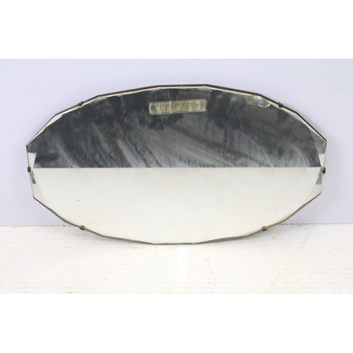 643 - Vintage octagonal mirror with stylised design, 35.5 x 61cm, shield shaped mirror, 31 x 50cm and anot... 
