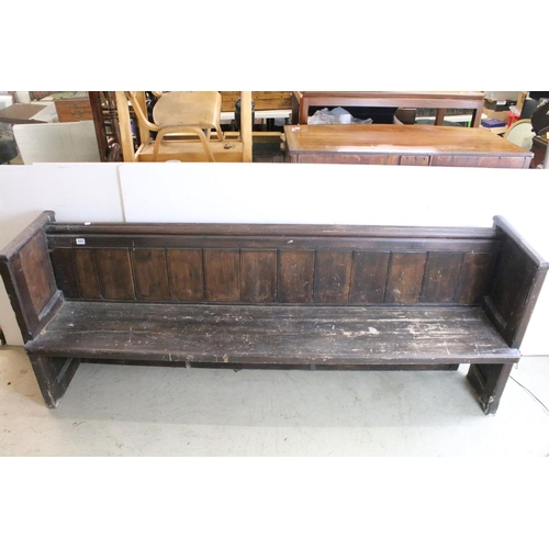 668 - Stained panelled pew, the end carved with arches and quatrefoil design, 81cm high x 207cm wide x 48c... 