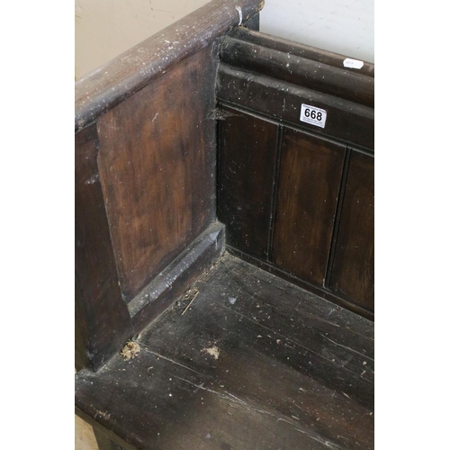 668 - Stained panelled pew, the end carved with arches and quatrefoil design, 81cm high x 207cm wide x 48c... 