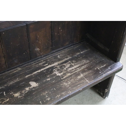 668 - Stained panelled pew, the end carved with arches and quatrefoil design, 81cm high x 207cm wide x 48c... 