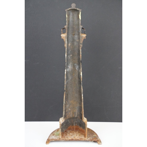 103 - Cast iron doorstop in the form of a lighthouse, with a semi circular base and spiral painted black &... 