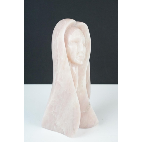 110 - Carved pink stone sculpture of a stylised female, engraved 'Morning Rise' and signed to base, approx... 