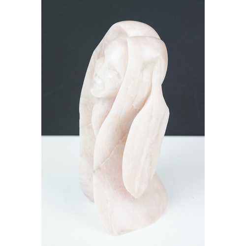 110 - Carved pink stone sculpture of a stylised female, engraved 'Morning Rise' and signed to base, approx... 