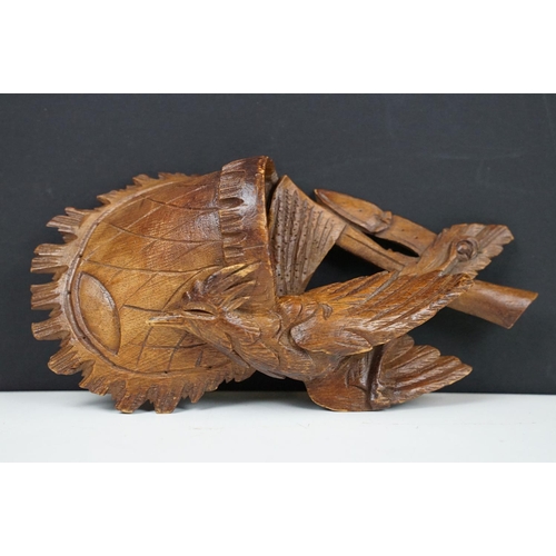 116 - Black Forest carved wooden Wall Pocket in the form of a hunting bag with game bird, approx 18cm high