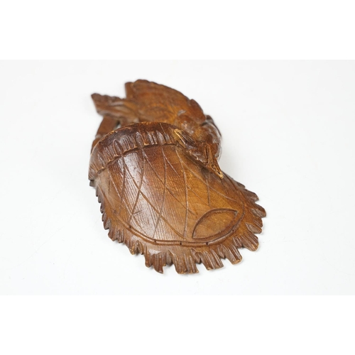 116 - Black Forest carved wooden Wall Pocket in the form of a hunting bag with game bird, approx 18cm high