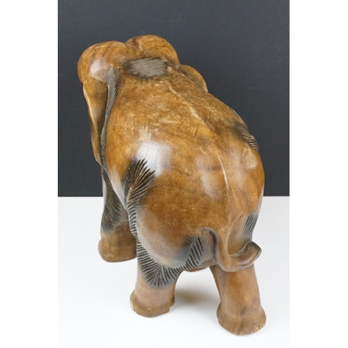 120 - Carved teak model of an elephant, approx 41cm high