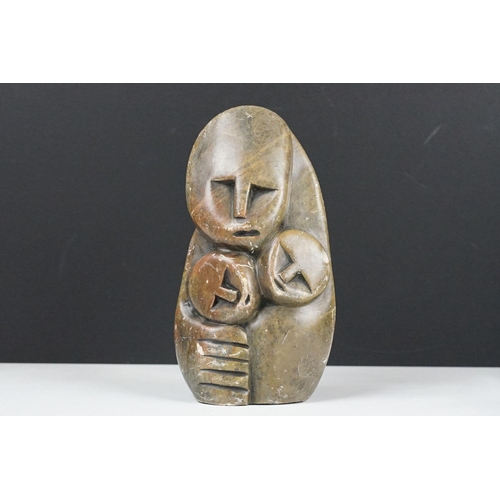 123 - Zimbabwean carved and polished Stone Sculpture of a stylised parent with two children, 18cm high