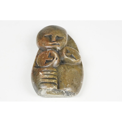 123 - Zimbabwean carved and polished Stone Sculpture of a stylised parent with two children, 18cm high