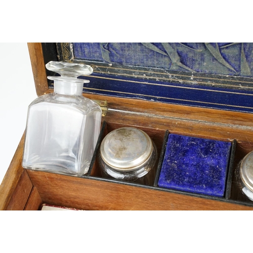 133 - 19th century walnut vanity box, the lid with mother of pearl inlay, opening to a fitted interior hou... 