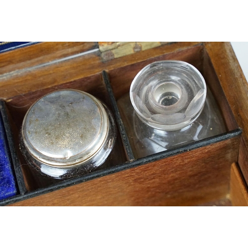 133 - 19th century walnut vanity box, the lid with mother of pearl inlay, opening to a fitted interior hou... 