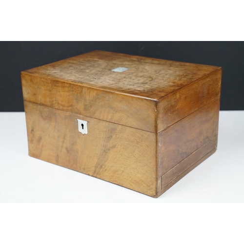 133 - 19th century walnut vanity box, the lid with mother of pearl inlay, opening to a fitted interior hou... 