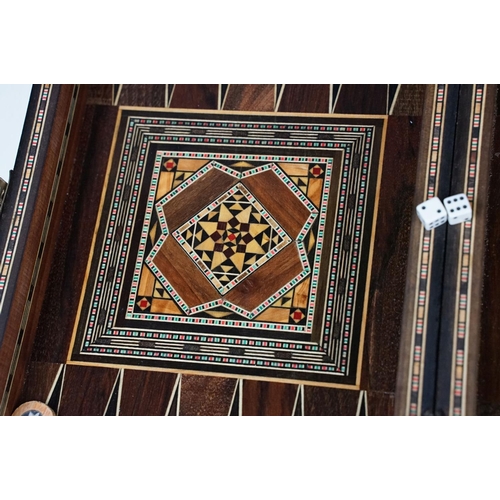 134 - Parquetry inlaid wooden games box, with internal backgammon board and external chess / draughts boar... 