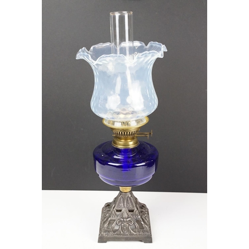 135 - Early-to-mid 20th C oil lamp with opalescent flared glass shade, chimney, cobalt blue glass font and... 