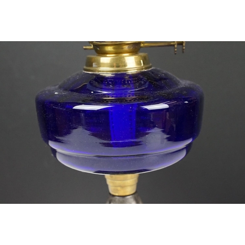 135 - Early-to-mid 20th C oil lamp with opalescent flared glass shade, chimney, cobalt blue glass font and... 