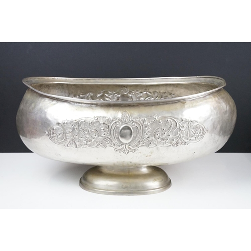 137 - Large early 20th century silver plated planter of oblong form, with repousse scrolling foliate decor... 