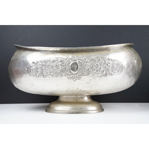 137 - Large early 20th century silver plated planter of oblong form, with repousse scrolling foliate decor... 