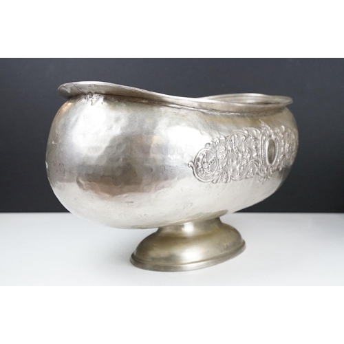 137 - Large early 20th century silver plated planter of oblong form, with repousse scrolling foliate decor... 