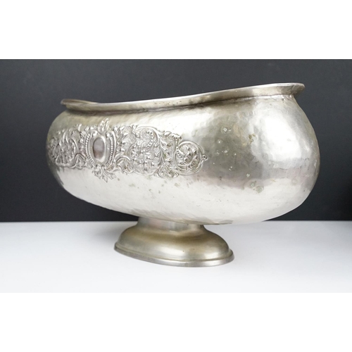 137 - Large early 20th century silver plated planter of oblong form, with repousse scrolling foliate decor... 