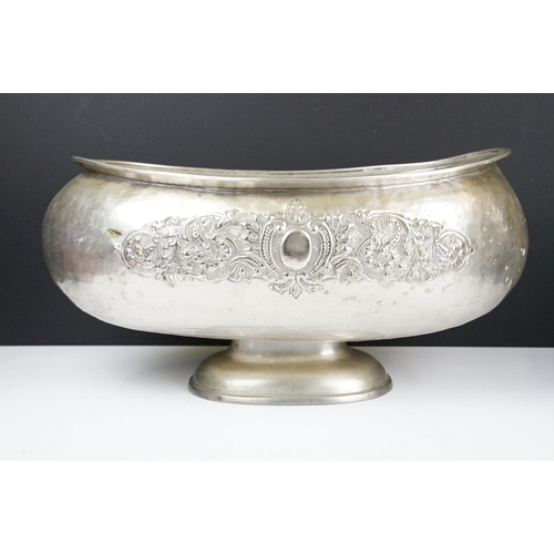 137 - Large early 20th century silver plated planter of oblong form, with repousse scrolling foliate decor... 