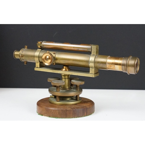 153 - Stanley brass theodolite, barrel marked ' 111338 Stanley, London ' with circular wooden stand and ma... 