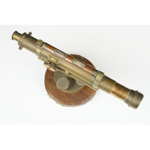 153 - Stanley brass theodolite, barrel marked ' 111338 Stanley, London ' with circular wooden stand and ma... 