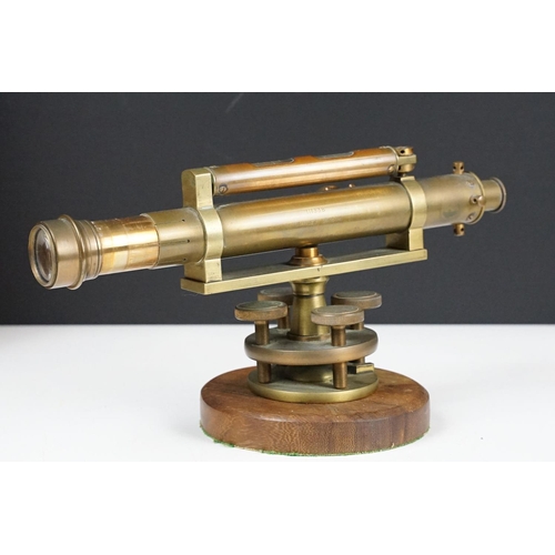 153 - Stanley brass theodolite, barrel marked ' 111338 Stanley, London ' with circular wooden stand and ma... 