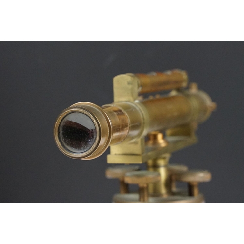 153 - Stanley brass theodolite, barrel marked ' 111338 Stanley, London ' with circular wooden stand and ma... 