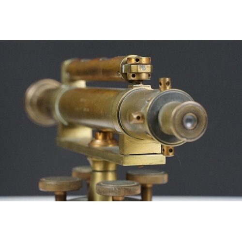 153 - Stanley brass theodolite, barrel marked ' 111338 Stanley, London ' with circular wooden stand and ma... 