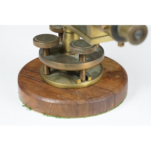 153 - Stanley brass theodolite, barrel marked ' 111338 Stanley, London ' with circular wooden stand and ma... 