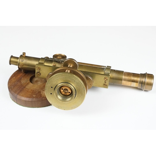 153 - Stanley brass theodolite, barrel marked ' 111338 Stanley, London ' with circular wooden stand and ma... 