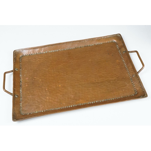 155 - Arts and Crafts hammered copper twin-handled tray, stamped J.P. to underside, maker's mark for John ... 