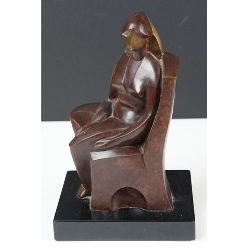 158 - Cast bronze sculpture in the form of a modernist stylised seated figure raised on a plinth base. Imp... 